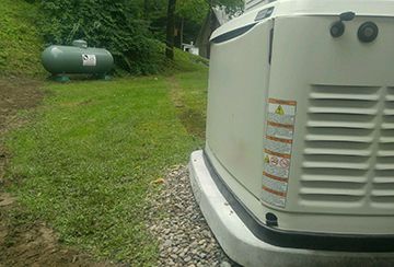generator propane tank hidden in shrubs