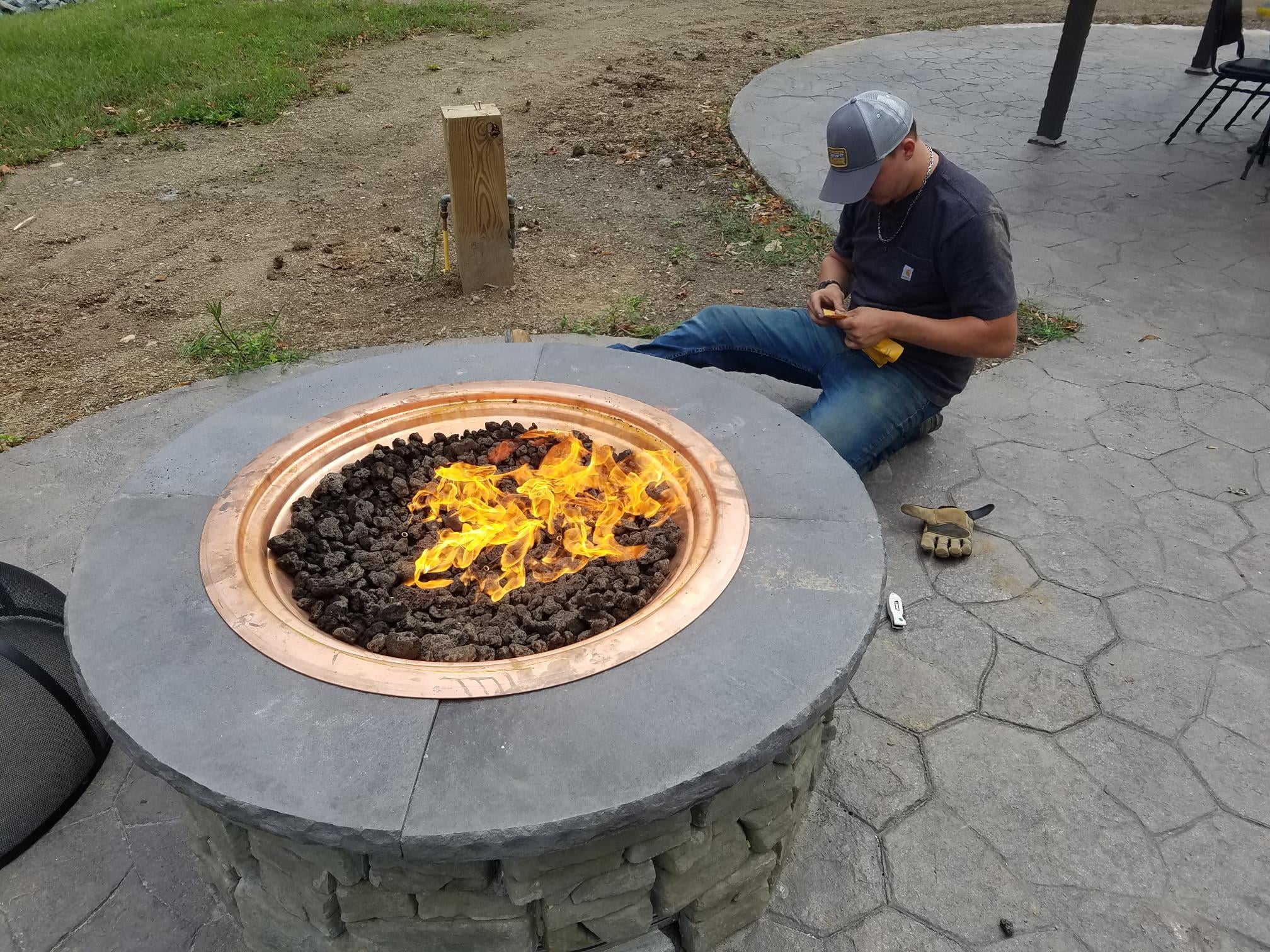 Custom firepit installed by Combined Energy Services